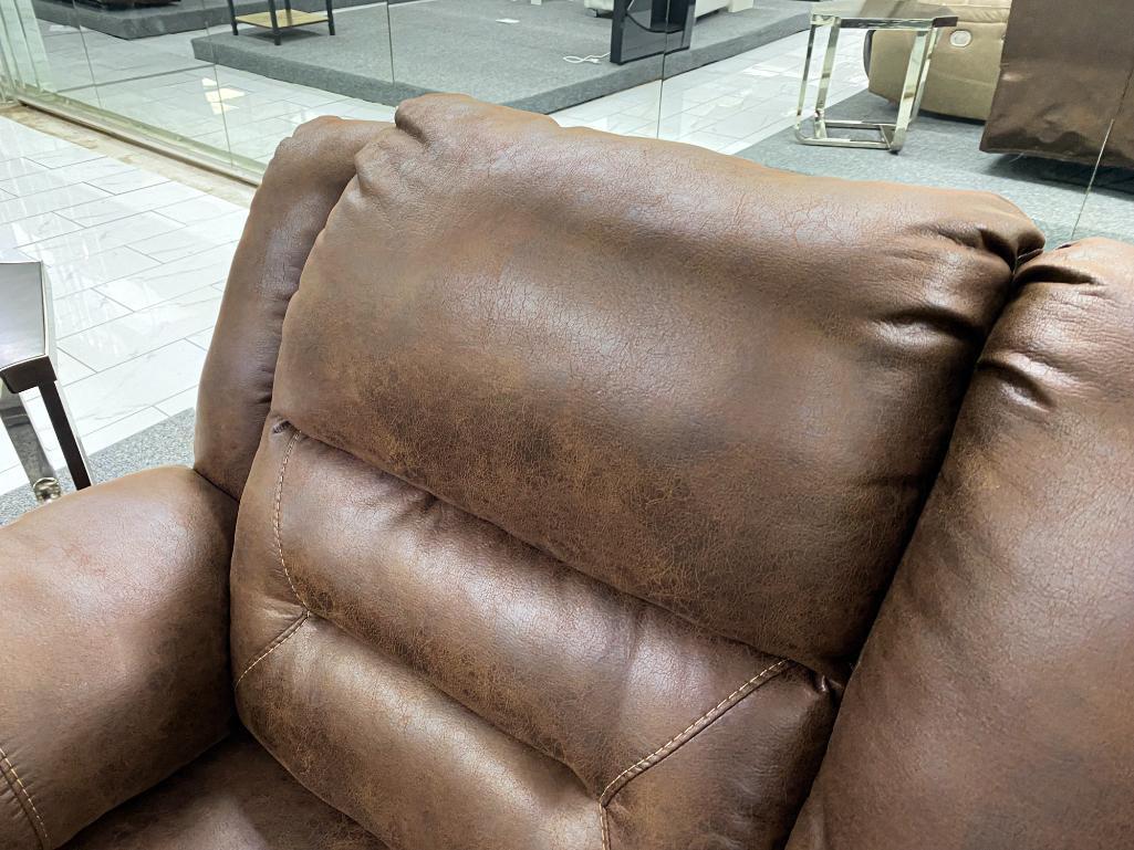 Traditional brown loveseat with electronic recliners and middle storage console, has 2 cupholders