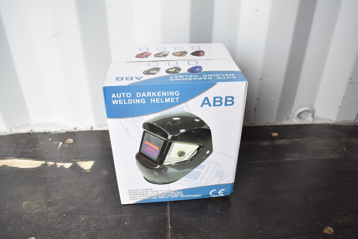 New in box auto darkening welding helmet