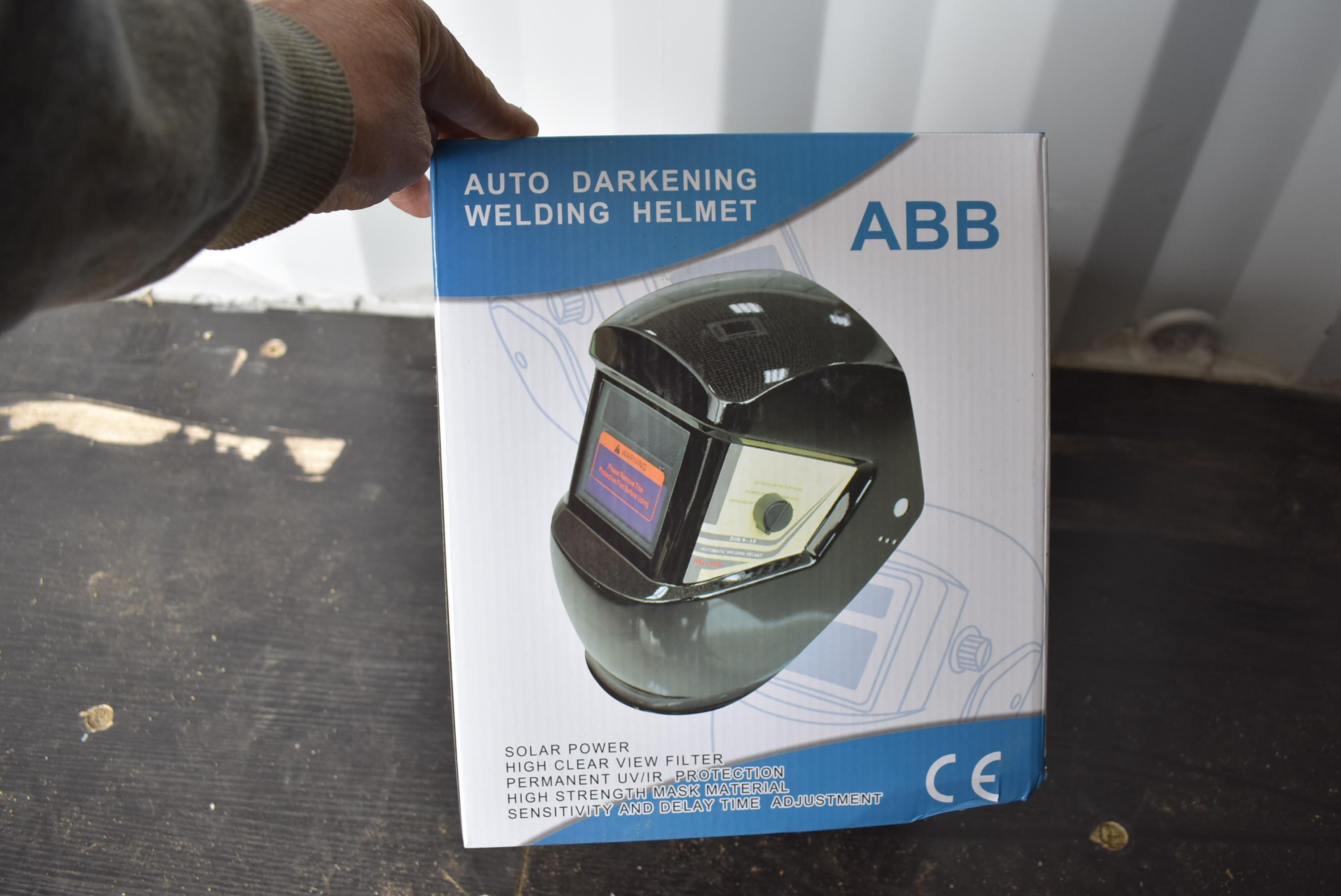 New in box auto darkening welding helmet