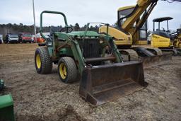 John Deere 775 tractor with bucket