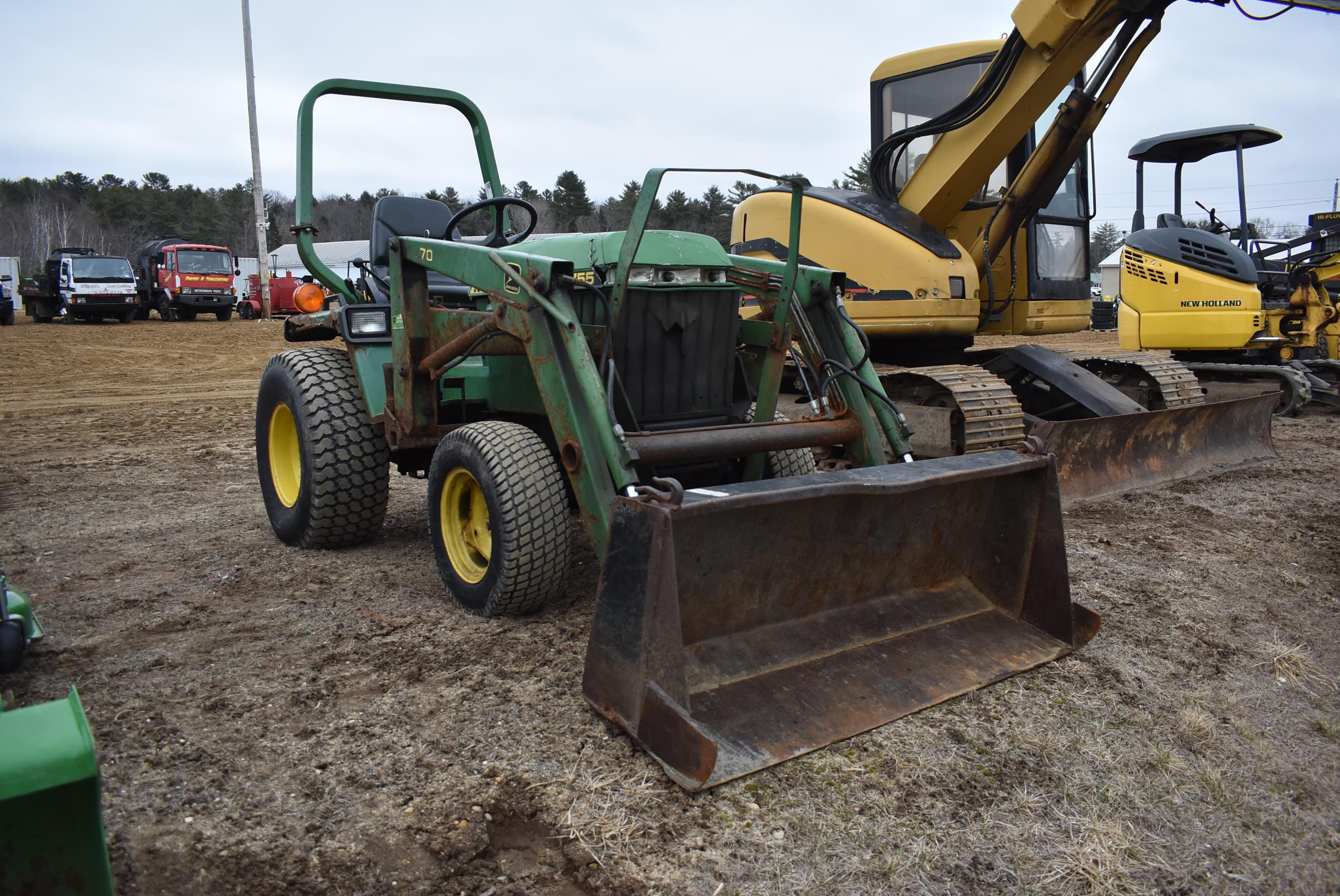 John Deere 775 tractor with bucket