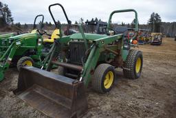 John Deere 775 tractor with bucket