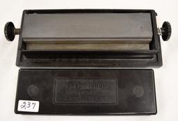Carborundum duo-stone sharpener in plastic case