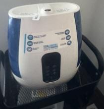 Air purifier on wheeled cart