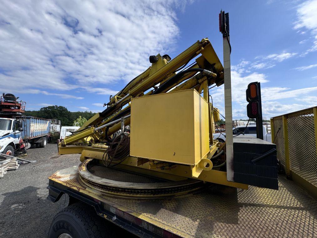 1996 International 4700 with Sterling Guard Rail Post Driver.
