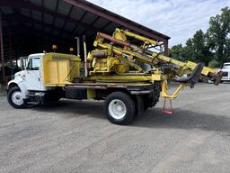 1996 International 4700 with Sterling Guard Rail Post Driver.