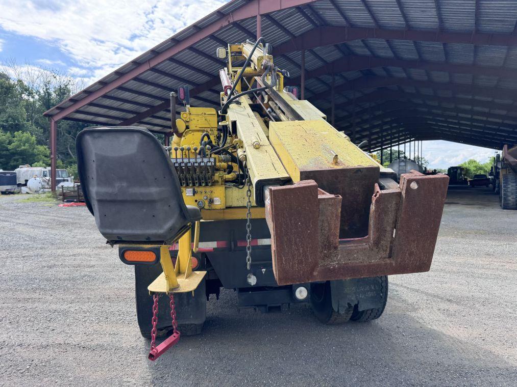 1996 International 4700 with Sterling Guard Rail Post Driver.