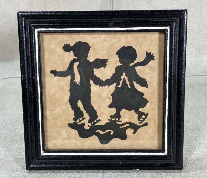 Silhouette of Children on Ice Skates
