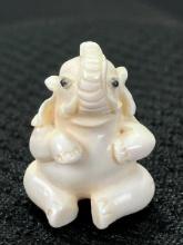 Carved Bone Miniature Seated Elephant