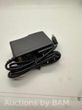 AC/DC adapter Model 0910 DC9V 1A