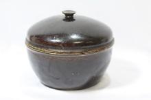 A Stoneware Bowl With Lid