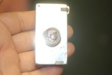 Crown Feather Flick With A Roman Coin Lighter