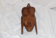 A Wooden Face Wall Hanger