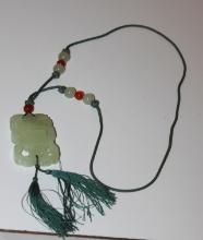 A Chinese Jade / Hardstone Movable Pendant
