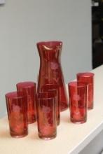 A Cranberry Cut Glass Tumbler and Pitcher