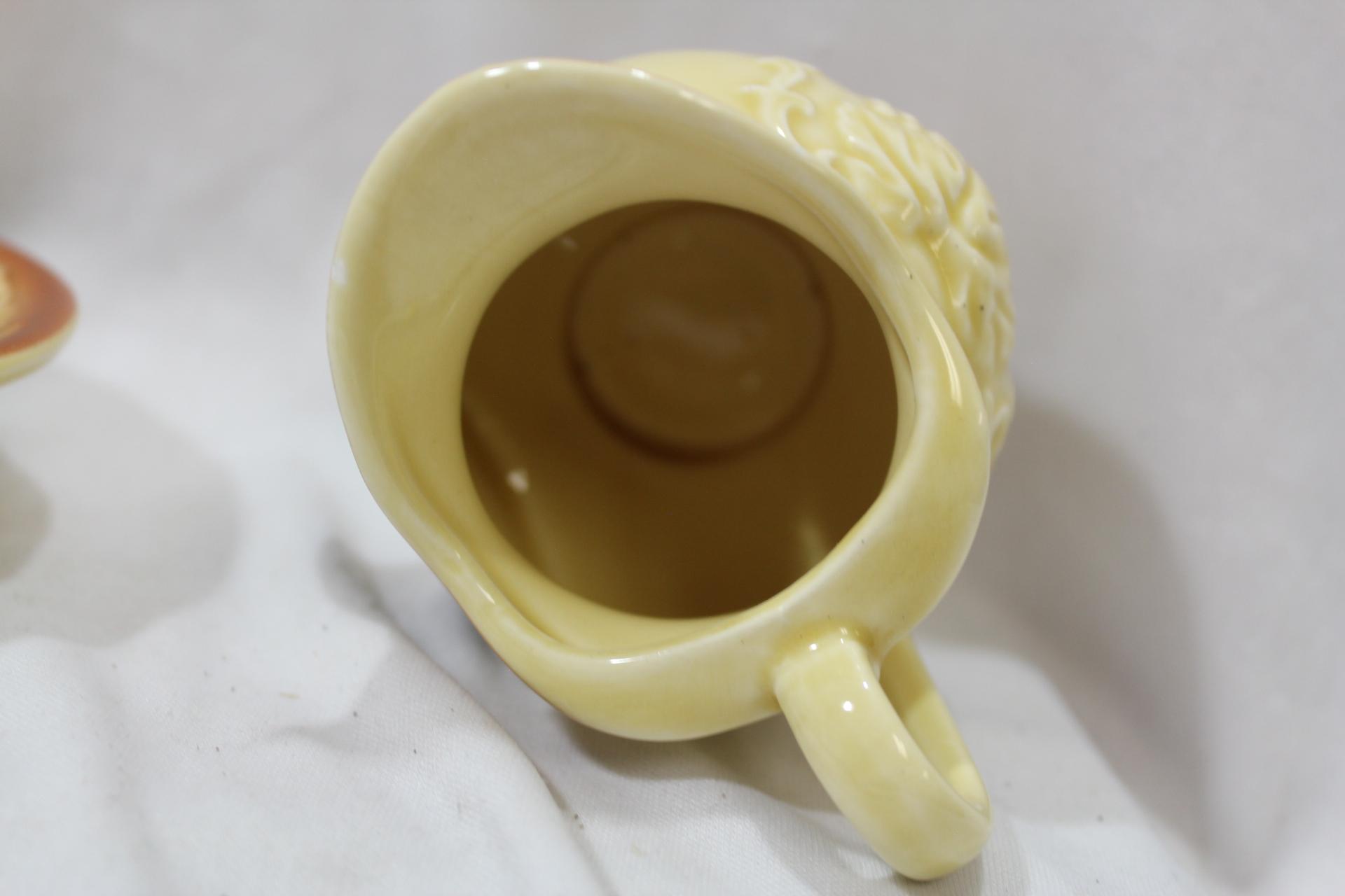 A Ceramic Pitcher and Undertray