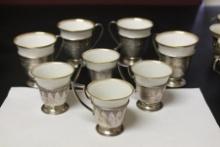 A Dermitasse Cup with Sterling Holder 2 Sets of 4