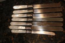 Lot of 7 Mother of Pearl and Sterling Ban Butter Knives