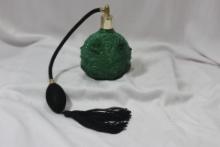 A Green Glass Parfume Bottle