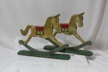 A Pair of Vintage Cast Iron Rocking Horses