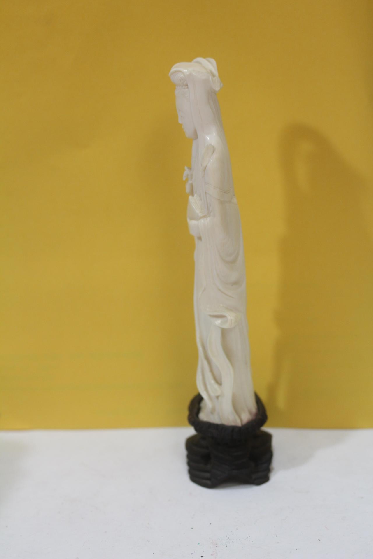 A Carved Bone Figurine