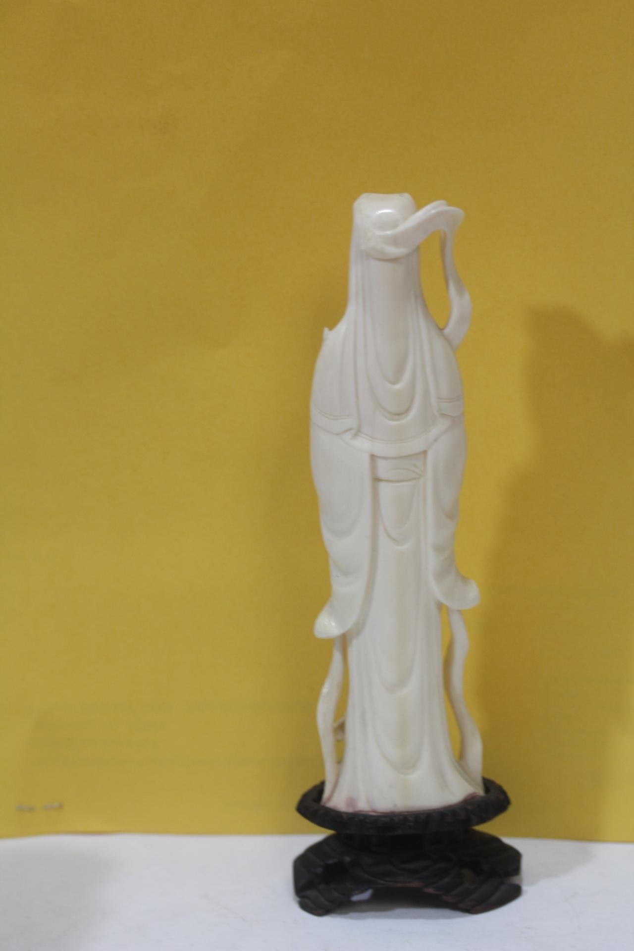 A Carved Bone Figurine