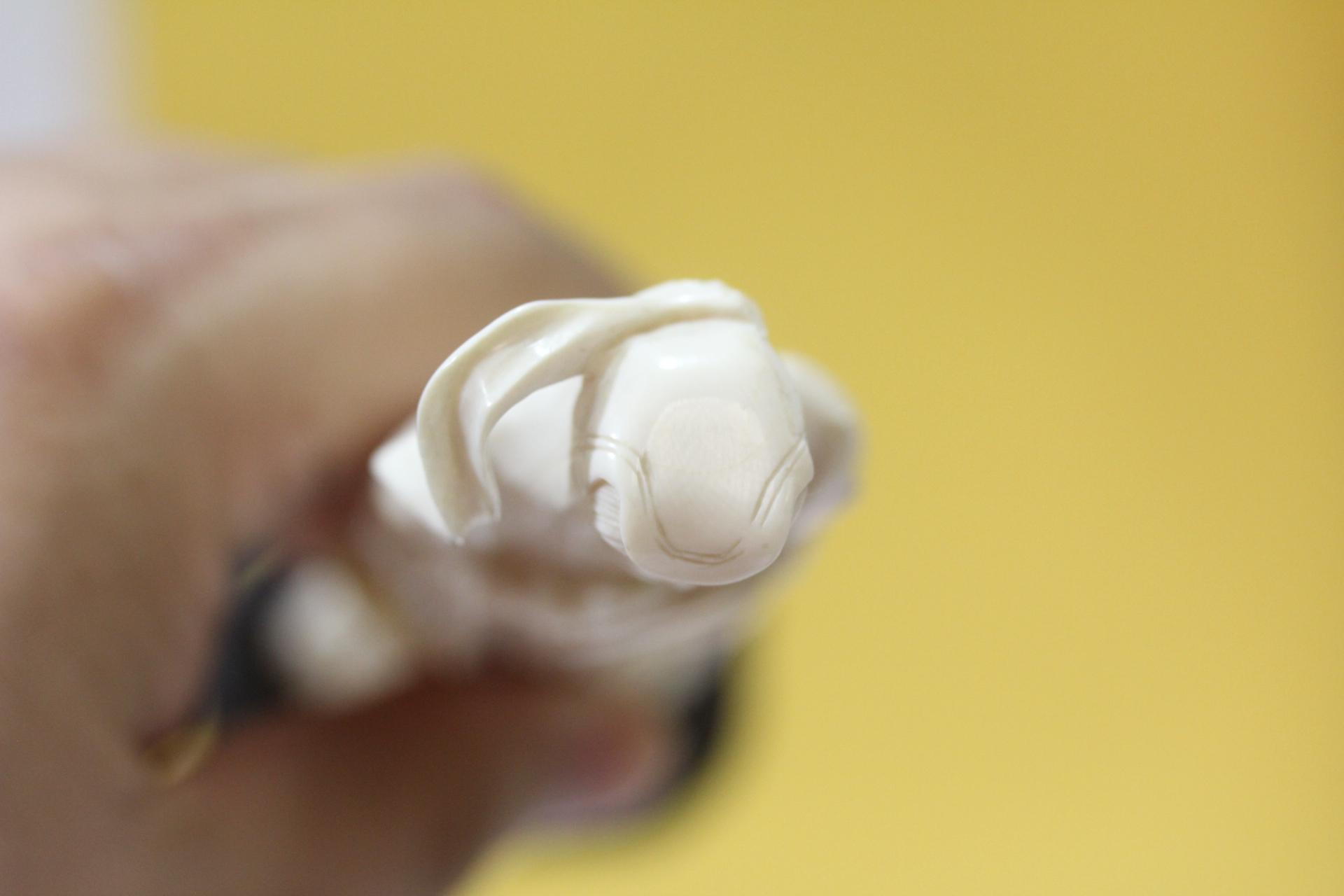 A Carved Bone Figurine