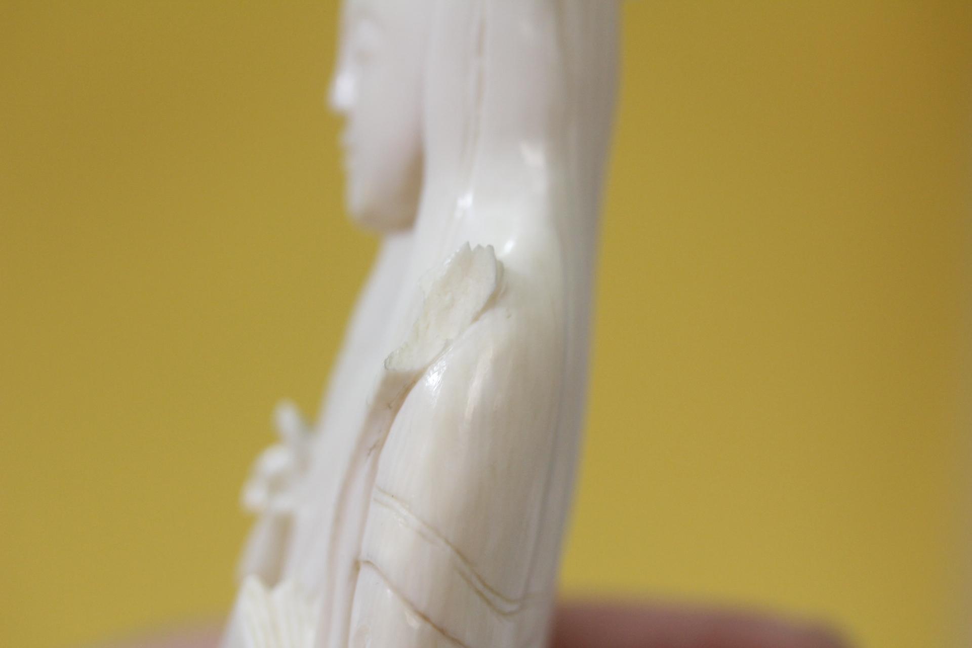 A Carved Bone Figurine
