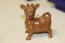 A Metal Cow Pepper Shaker