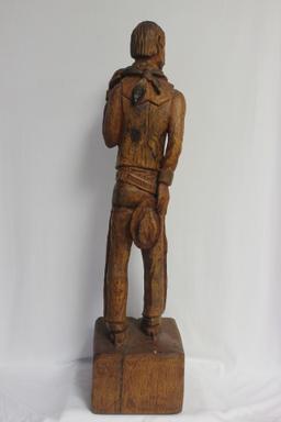 A Wood Statue of a Cowboy