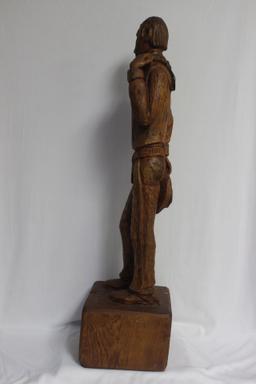 A Wood Statue of a Cowboy