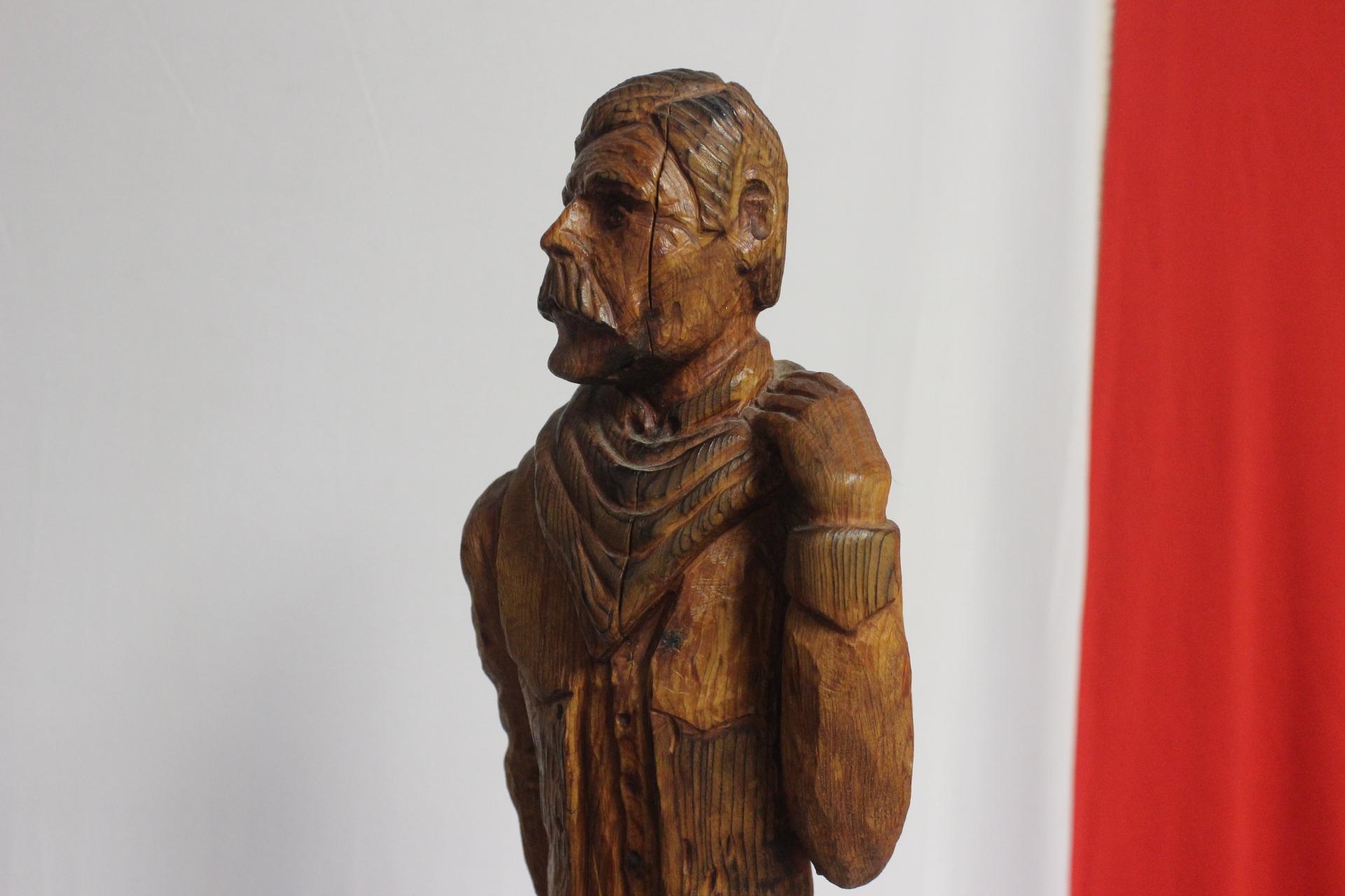 A Wood Statue of a Cowboy