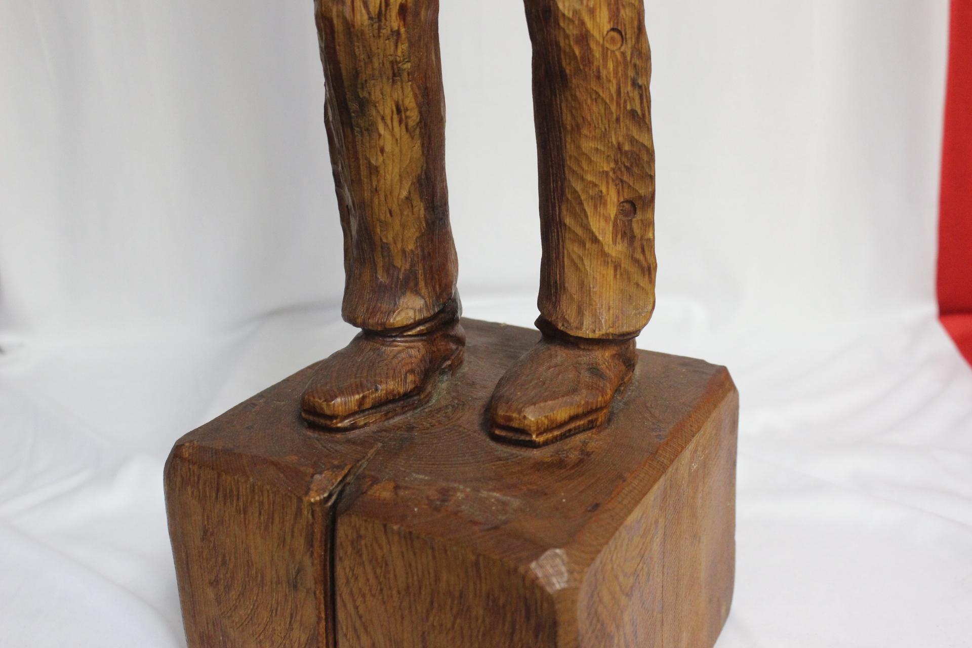 A Wood Statue of a Cowboy