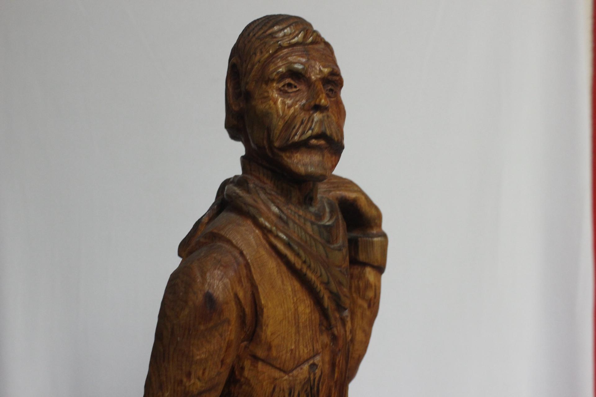 A Wood Statue of a Cowboy