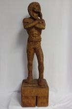 A Wood Statue of a Native American Man