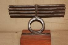 Signed Metal Sculpture on Wood