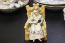 A Seated Ceramic Figure