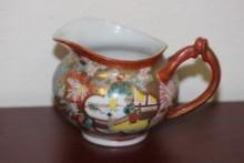A Signed Kutani Creamer