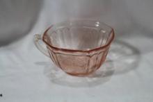 A Pink Depression Glass Cup