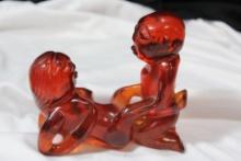 An Amber Resin Erotica Figurine