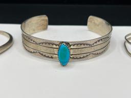 THREE NAVAJO STERLING SILVER TURQUOISE CUFF BRACELET INCLUDING ONE SIGNED BY LARRY BENNETT