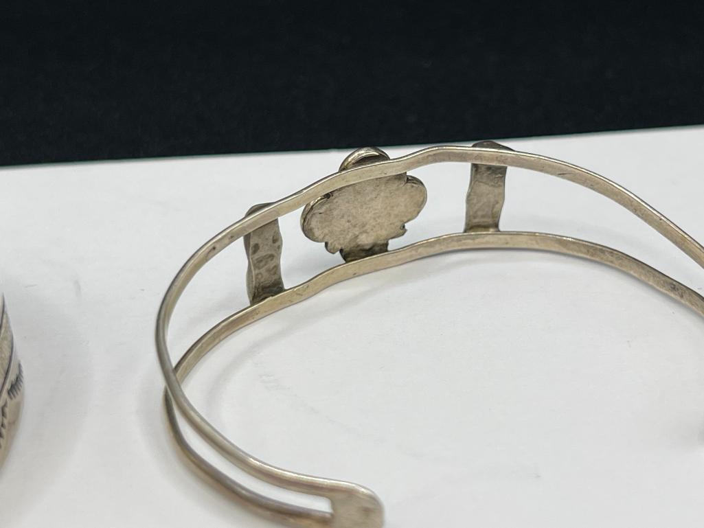 THREE NAVAJO STERLING SILVER TURQUOISE CUFF BRACELET INCLUDING ONE SIGNED BY LARRY BENNETT