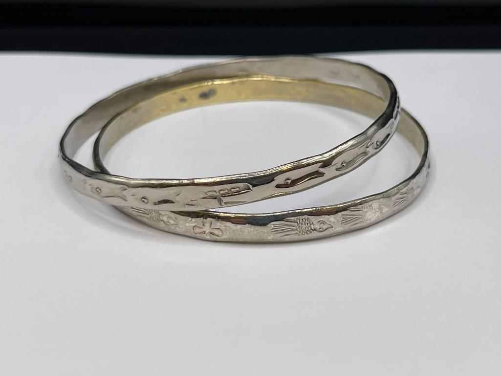 PAIR OF SILVERTONED SOUTHWESTERN BANDLE BRACELETS