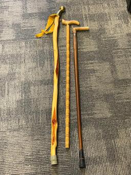 THREE WOOD WALKING STICKS INCLUDING ONE POLISHED PINE WITHG BRASS NOB HANDLE