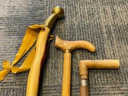 THREE WOOD WALKING STICKS INCLUDING ONE POLISHED PINE WITHG BRASS NOB HANDLE