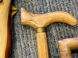 THREE WOOD WALKING STICKS INCLUDING ONE POLISHED PINE WITHG BRASS NOB HANDLE