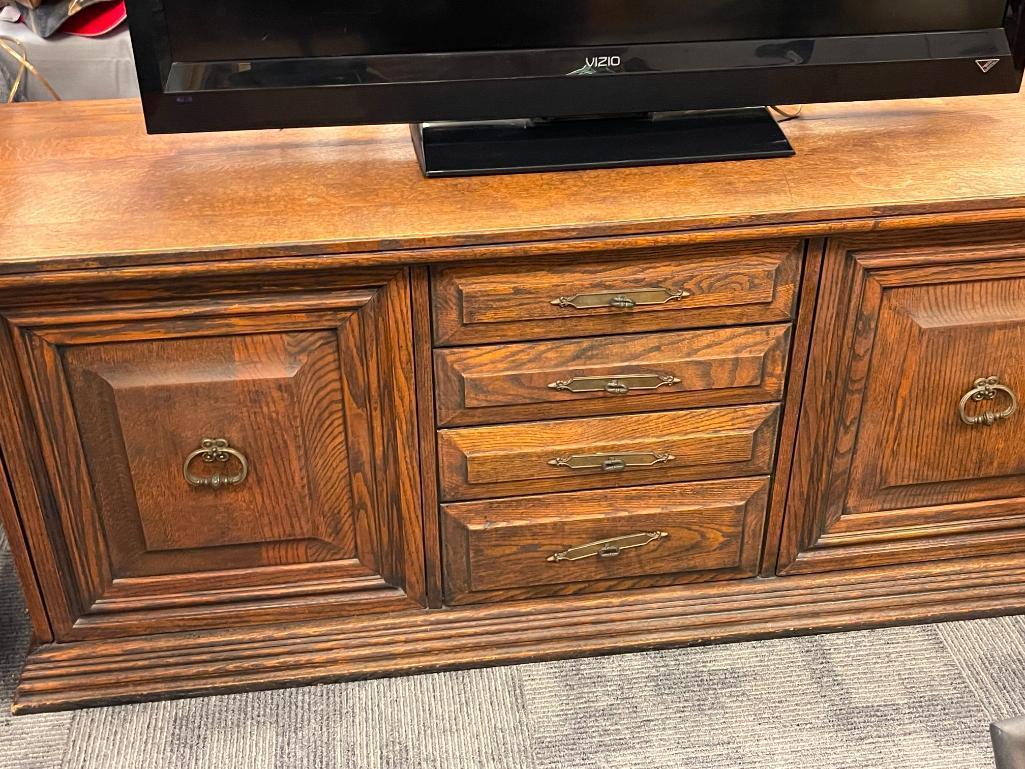 VINTAGE SOLID OAK CONSOLE TABLE FEATURING THREE DRAWERS AND TWO CABINETS