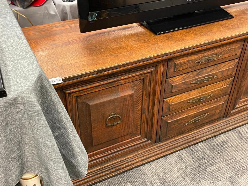VINTAGE SOLID OAK CONSOLE TABLE FEATURING THREE DRAWERS AND TWO CABINETS