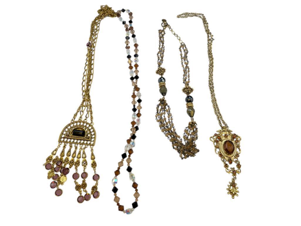 FOUR GOLD TONE STATEMENT NECKLACES INCLUDING THREE VINTAGE, ONE BEADED, AND ONE BY MAYA