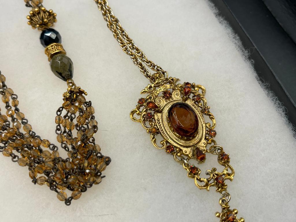 FOUR GOLD TONE STATEMENT NECKLACES INCLUDING THREE VINTAGE, ONE BEADED, AND ONE BY MAYA